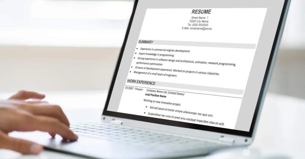A job seeker reviewing a digital resume and applying job search strategies to optimize it for 2026 roles