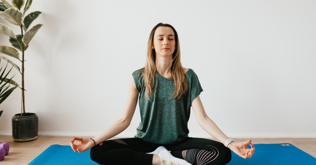 Woman practicing deep breathing before a job interview to stay calm and confident.